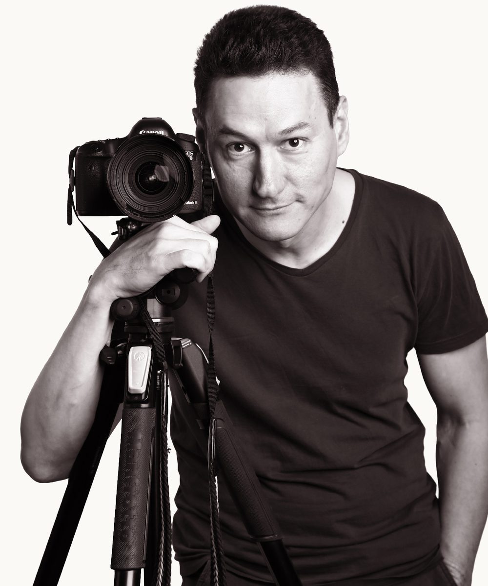 Georgy Ruchin, real estate photographer, with his camera