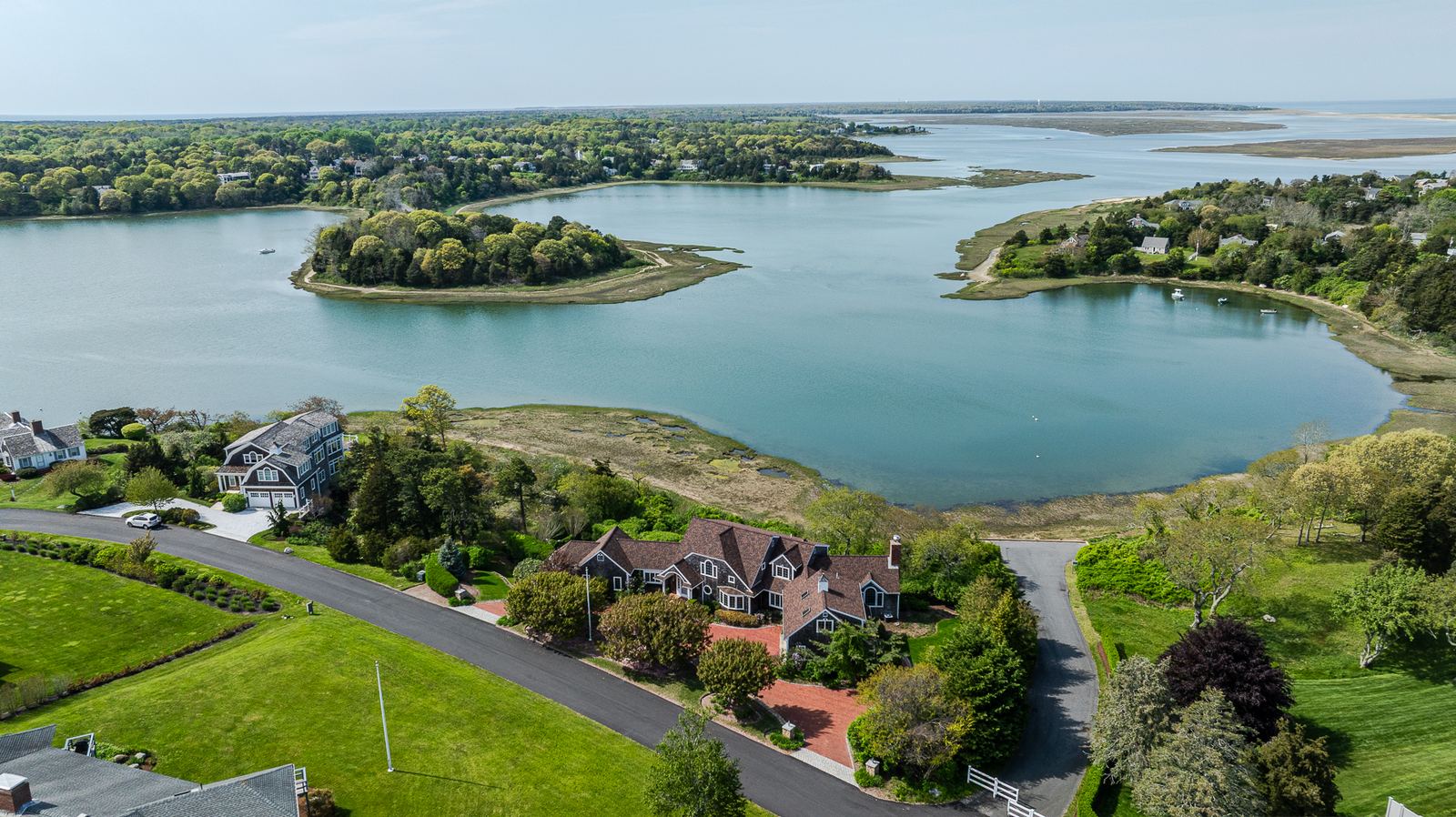Aerial view of a waterfront home on a bay