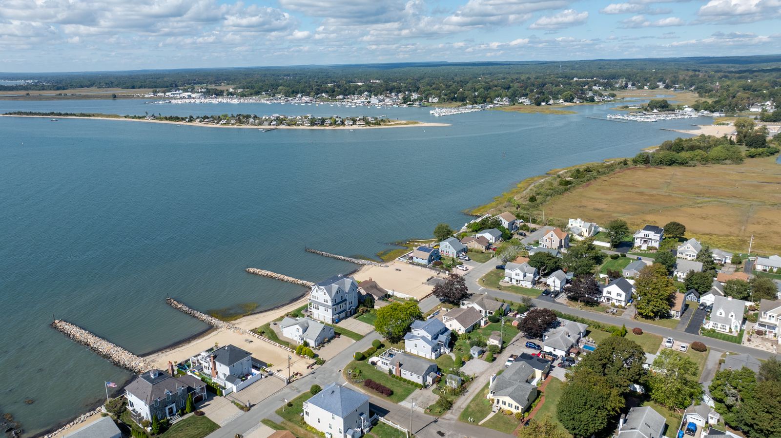 Aerial view of a harbor and coastal community