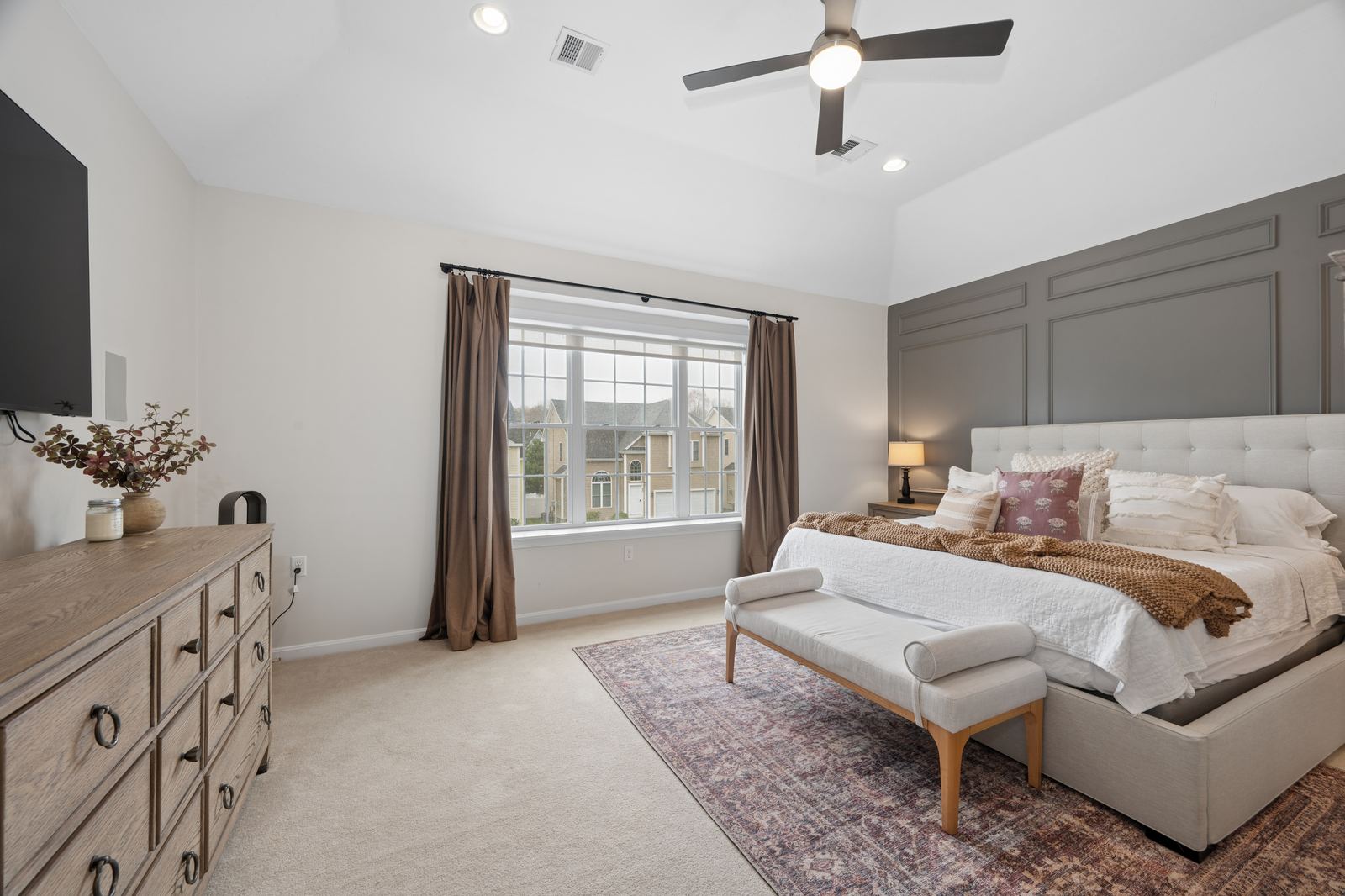Bedroom with panelled accent wall