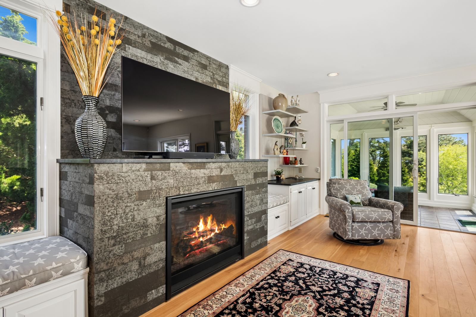 Living room with stone fireplace